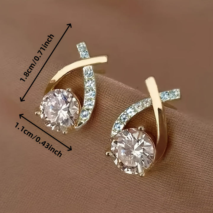 Milena | Pendientes de botón con diseño de cruz, circonitas y acabado dorado