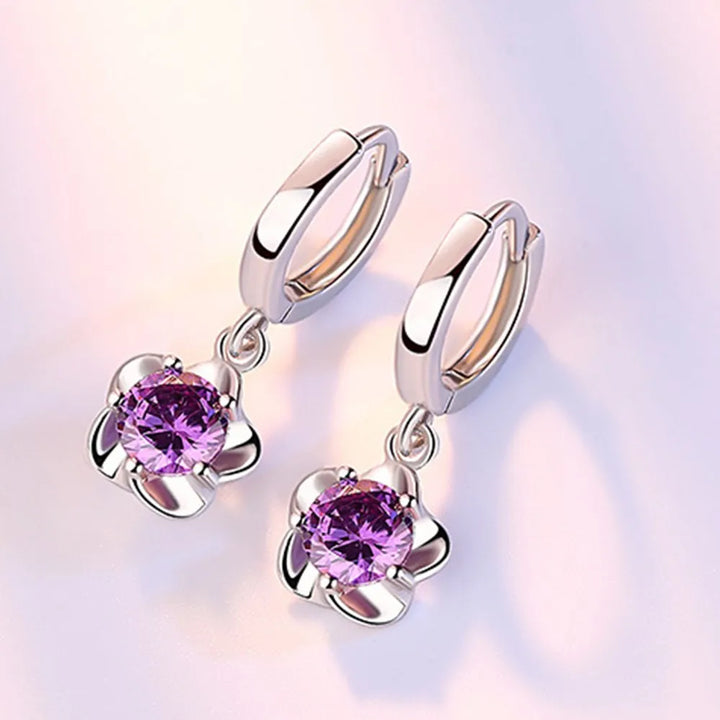 Beatriz | Pendientes con circonitas moradas y blancas con acabado plateado