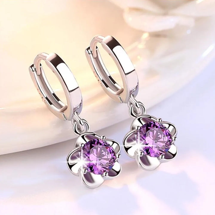 Beatriz | Pendientes con circonitas moradas y blancas con acabado plateado